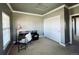 This office space has white trim, carpeted floors, a desk, and a closet, making it ideal for working from home at 690 Antelope Dr, Bennett, CO 80102