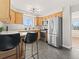 Modern kitchen with stainless steel appliances and light wood cabinets at 4890 S Inca St, Englewood, CO 80110