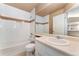 Bright bathroom features white tile, bathtub, and vanity at 6418 Silver Mesa Dr # C, Highlands Ranch, CO 80130
