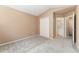 Bedroom with en-suite bathroom and double-door closet at 6418 Silver Mesa Dr # C, Highlands Ranch, CO 80130