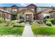 Charming townhome with brick accents, well-maintained landscaping, and inviting front entrance at 6418 Silver Mesa Dr # C, Highlands Ranch, CO 80130