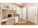 Bright office space includes a built-in desk, storage, and decorative shelving, perfect for working from home at 6418 Silver Mesa Dr # C, Highlands Ranch, CO 80130