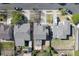 Bird's eye view shows well-kept homes with tidy yards and mature trees in a quiet residential area at 13931 E 104Th Dr, Commerce City, CO 80022