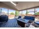 Cozy covered patio features a fire pit, comfortable seating, and outdoor grill for the perfect entertainment space at 13931 E 104Th Dr, Commerce City, CO 80022