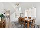 Bright dining room featuring a vaulted ceiling, wood table, and decor at 13931 E 104Th Dr, Commerce City, CO 80022
