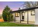 Outdoor back porch with green grass and white trim exterior, perfect for relaxing at 6369 W 69Th Ave, Arvada, CO 80003