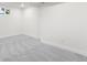 Spacious basement area with neutral carpet and white walls, ready for customization at 6369 W 69Th Ave, Arvada, CO 80003