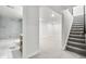 Finished basement featuring a full bathroom, living space and staircase at 6369 W 69Th Ave, Arvada, CO 80003