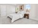 Light filled bedroom featuring modern neutral decor with gray carpet and white walls at 6369 W 69Th Ave, Arvada, CO 80003