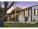 Charming home with stone accents, a well-maintained lawn, and appealing curb appeal at 6369 W 69Th Ave, Arvada, CO 80003