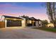 Ranch home featuring a spacious driveway and a convenient two-car garage at 6369 W 69Th Ave, Arvada, CO 80003