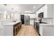 Beautiful, bright kitchen with white cabinetry, stylish countertops, and modern lighting at 6369 W 69Th Ave, Arvada, CO 80003