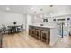 Open concept living space features counter seating and pendant lighting at 6369 W 69Th Ave, Arvada, CO 80003