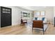 Inviting living room with a bay window, light colored sofa, and elegant hardwood floors at 6369 W 69Th Ave, Arvada, CO 80003