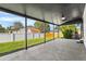 Covered back patio with a concrete floor, offering views of the backyard and adjacent homes at 6369 W 69Th Ave, Arvada, CO 80003