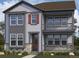 Charming two-story home featuring stone accents, shutters, a cozy porch, and a classic design for comfortable living at 24207 E 53Rd Dr, Aurora, CO 80019