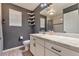 Modern bathroom featuring a vanity with a white countertop, mirror, and tiled shower at 18096 E 104Th Way, Commerce City, CO 80022