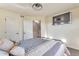 Well-lit bedroom with a modern ceiling fan and a staircase leading to another level at 18096 E 104Th Way, Commerce City, CO 80022