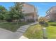 Inviting two-story home featuring a well-maintained lawn and concrete steps leading to the front door at 18096 E 104Th Way, Commerce City, CO 80022