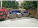 Cozy patio featuring matching chairs with navy blue cushions for outdoor relaxation and comfort at 18096 E 104Th Way, Commerce City, CO 80022