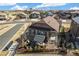 Aerial view of home with a cozy backyard featuring an outdoor seating area and manicured landscaping at 7743 S Quantock Way, Aurora, CO 80016