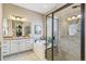 Bathroom featuring a tiled walk-in shower and soaking tub, next to a large vanity with neutral toned countertop at 7743 S Quantock Way, Aurora, CO 80016