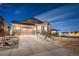 Charming single-Gathering home featuring a two-car garage, beautiful stone accents, and inviting curb appeal at 7743 S Quantock Way, Aurora, CO 80016