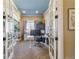 Well-lit home office with built-in shelving and a comfortable workspace at 7743 S Quantock Way, Aurora, CO 80016