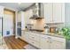 Gourmet kitchen featuring granite countertops, stainless steel appliances, and custom cabinetry at 7743 S Quantock Way, Aurora, CO 80016