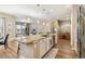 Open concept kitchen with a large island, stainless steel appliances, and breakfast bar at 7743 S Quantock Way, Aurora, CO 80016
