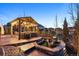 Cozy outdoor patio area with comfortable seating, a fire pit, and stylish lighting for evening relaxation at 7743 S Quantock Way, Aurora, CO 80016