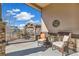 Inviting outdoor patio with wicker furniture, a pergola, and scenic neighborhood views at 7743 S Quantock Way, Aurora, CO 80016