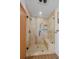Modern tiled shower stall with built-in shelving and a sleek glass door at 9745 Hilldale Dr, Morrison, CO 80465