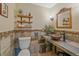 Charming powder room showcases a rustic vessel sink, stone tile accents, and open shelving at 9745 Hilldale Dr, Morrison, CO 80465