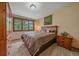 Bedroom features natural light with a view of nature outside the window at 9745 Hilldale Dr, Morrison, CO 80465