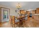 Eat-in dining area features a wood table with seating for four and bar-top seating to the kitchen at 9745 Hilldale Dr, Morrison, CO 80465