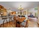 Eat-in dining area features a wood table with seating for four and bar-top seating to the kitchen at 9745 Hilldale Dr, Morrison, CO 80465