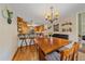 Eat-in dining area features a wood table with seating for four and bar-top seating to the kitchen at 9745 Hilldale Dr, Morrison, CO 80465
