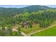 Beautiful mountain home situated on a large lot surrounded by lush trees at 9745 Hilldale Dr, Morrison, CO 80465