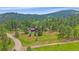 Beautiful mountain home situated on a large lot surrounded by lush trees at 9745 Hilldale Dr, Morrison, CO 80465