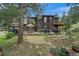 Charming two-story home featuring an attached garage and spacious outdoor deck at 9745 Hilldale Dr, Morrison, CO 80465