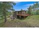 Charming two-story home with spacious deck and wooded views at 9745 Hilldale Dr, Morrison, CO 80465
