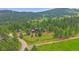 Beautiful mountain home situated on a large lot surrounded by lush trees at 9745 Hilldale Dr, Morrison, CO 80465