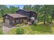 Charming two-story home featuring an attached garage and spacious outdoor deck at 9745 Hilldale Dr, Morrison, CO 80465
