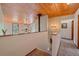 Bright interior view showcasing the wooden ceiling and railing around the landing at 9745 Hilldale Dr, Morrison, CO 80465