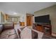 Living room features a functional office space and comfortable leather seating at 9745 Hilldale Dr, Morrison, CO 80465