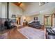 Living room showcasing a wood-burning stove, high ceilings, and comfortable seating at 9745 Hilldale Dr, Morrison, CO 80465