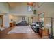 Spacious living room with soaring ceilings, clerestory windows, and comfortable leather seating at 9745 Hilldale Dr, Morrison, CO 80465