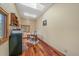 Bright office space with skylight, built-in shelves, and hardwood flooring at 9745 Hilldale Dr, Morrison, CO 80465