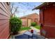 Backyard patio area with adjacent shed, a cozy setting for outdoor enjoyment and storage at 1717 E 22Nd Ave, Denver, CO 80205